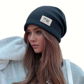 Women's autumn and winter simple trimmed loose knitted hat, solid color warm earmuffs stretch hat