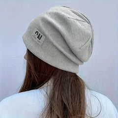 Women's autumn and winter simple trimmed loose knitted hat, solid color warm earmuffs stretch hat