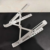 1 piece adjustable laptop stand, 7 angles tilt, portable and foldable ABS plastic, helps improve airflow