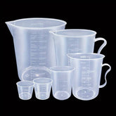 Set of 6 clear plastic measuring cups with easy-pour spouts, durable and precise for baking and cooking