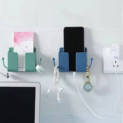 One adhesive wall mount with hooks, perfect for holding phone chargers and remote controls.