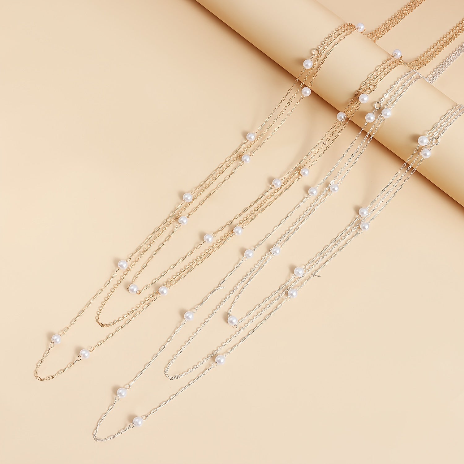 A Stylish And Elegant Three Layer Faux Pearl Long Necklace for Autumn And Winter  Featuring a Geometric Trendy Design  Suitable for Women to Wear on a Daily Basis  for Commuting  Parties  Dates  Music Festivals  And More.