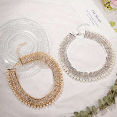 An exaggerated rhinestone and faux necklace suitable for daily wear by women