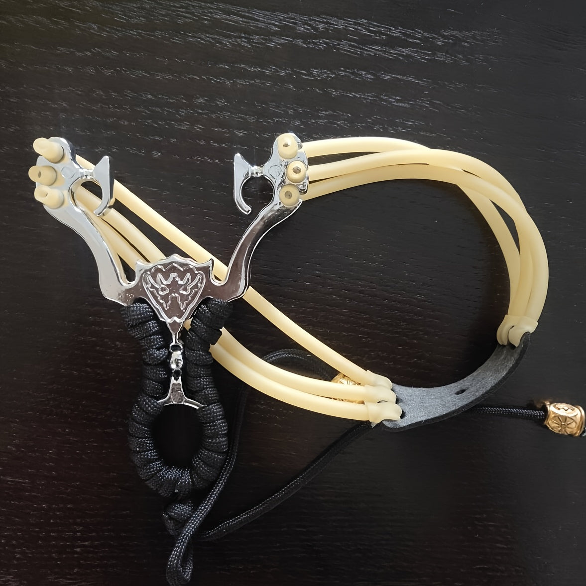 4pcs High Performance Slingshot Launcher Set with Quick Press Rubber Bands   Heavy Duty & Ultra Portable with Ergonomic Grip  Safety Lock & Wrist Strap   Ideal for Outdoor Shooting  Fishing  Camping  Hiking   Perfect Gift for Adults (Black)   Ideal for Ch