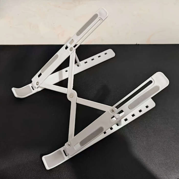 1 piece adjustable laptop stand, 7 angles tilt, portable and foldable ABS plastic, helps improve airflow