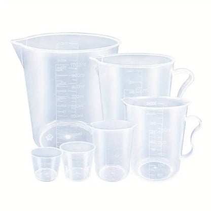 Set of 6 clear plastic measuring cups with easy-pour spouts, durable and precise for baking and cooking