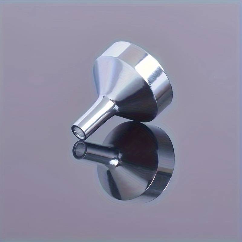 A set of small gold funnels designed specifically for perfumes and essential oils, making it easy to transfer and pour various liquids.